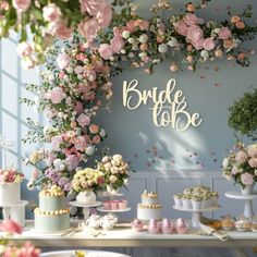 a table filled with cakes and cupcakes under a sign that says bride to be