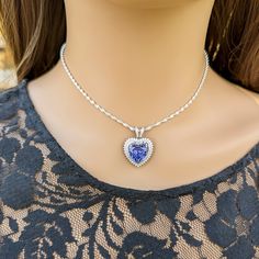 This gorgeous Sterling Silver cubic zirconia studded Tanzanite heart necklace and earring set would make the perfect classy gift for a bridesmaid, as an anniversary gift, for Valentine's Day or for Mother's Day. Tanzanite is the birthstone for those born in December, making it a thoughtful birthday gift as well! Pictures were taken both indoor and outdoors to best represent color. ~Measurements~ The heart pendant measures 1" tall and 3/4" wide. The Tanzanite heart stone is 12mm x 12mm. The match Born In December, Well Pictures, Tanzanite Jewelry, Jewelry Heart, Heart Stone, Jewelry Bridal, Necklace And Earring Set, December Birthstone, Hair Accessories Jewelry