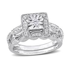 a white gold ring set with a square diamond center surrounded by round brilliant cut diamonds