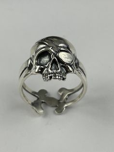 Elevate your style with our unique Silver Human Skull Statement Ring, a bold and edgy piece of gothic jewelry.  Key Features: - Handcrafted from high-quality silver, featuring a detailed human skull design that makes a striking statement - Gothic-inspired ring that adds a touch of edgy elegance to any outfit, perfect for those with a love for the macabre - Versatile design suitable for both men and women, making it a standout accessory for any occasion - Ideal as a gift for anyone who appreciate Gothic Jewelry Rings, Rings Gothic, Goth Ring, Spike Ring, Edgy Elegance, Edgy Accessories, Bone Jewelry, Gothic Rings, Dope Jewelry