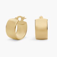 An instantly iconic addition to your ear stack, these lobe-hugging 14k yellow gold hoops are designed with a sleek low profile curve that leaves a bold impression on its own or effortlessly paired with your go-to studs. Modern Oval Huggie Earrings For Anniversary, Minimalist Oval Huggie Earrings For Anniversary, Formal Minimalist Oval Huggie Earrings, Classic Gold Plated Huggie Earrings, Minimalist Polished Finish Huggie Earrings For Formal, Classic Gold-plated Huggie Earrings, Modern Oval Tarnish Resistant Huggie Earrings, Classic 14k Yellow Gold Huggie Earrings, Elegant Yellow Gold Huggie Earrings With Polished Finish