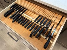 a drawer full of knives and knives in it