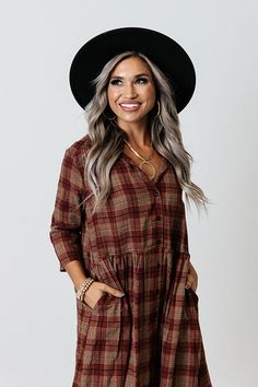 You will surely be in a cherry mood when you wear this charming tunic dress featuring lightweight material patterned with a brown and dark red hued plaid print, a v-cut neckline, loose 3/4-length sleeves, and a relaxed silhouette that falls into a straight mid-thigh length hemline! Measurements S : Bust 44", Hip 50", Length 33", Sleeve Length 15.5", Waist 44". M : Bust 46", Hip 52", Length 33.5", Sleeve Length 16", Waist 46". L : Bust 48", Hip 54", Length 34", Sleeve Length 16", Waist 48". XL : Casual Brown Plaid Dress For Fall, Long Sleeve Brown Plaid Dress For Fall, Fall Plaid V-neck Dress, Plaid Tunic Dress, Plaid Tunic, Plaid Jacket, Model Fits, V Cut, V Cuts