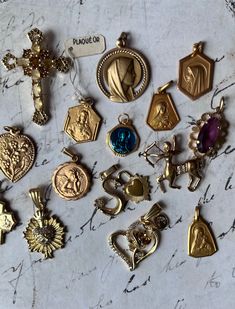 Lovely French Antique 18k Religious Goldplated Charms  24k color stainless steel pendants handmade vintage necklace Choose your charms from this beautiful set of 25 charms , The numbers are on the photo, select the nr charm(s) from the drop-down menu , Each charm comes with an adjustable 22" metal steel chain in matching color. (see behind each number in menu what material and period. Worldwide shipping within two weeks French Antique, Stainless Steel Pendant, Steel Chain, Vintage Necklace, French Antiques, Pendant Necklaces, Color Matching, Favorite Jewelry, Netherlands