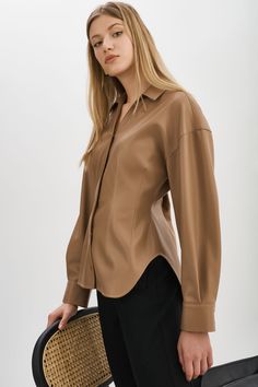 Indulge your fashion sensibilities with the irresistible allure of the Skylar Faux Leather Shirt. Designed to captivate, this statement piece boasts an hourglass silhouette & tapered waist. Chic Long Sleeve Faux Leather Top, Faux Leather High Neck Long Shirt, Leather Shirt, Shirt Collar, Mocha, Faux Leather, Collar, Leather