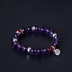 Crafted with 925 silver and adorned with an elegant amethyst lotus charm, this bracelet exudes a timeless sophistication. The amethyst is known for its calming and healing properties, making this bracelet not only a beautiful accessory but also a potential source of positive energy. Tarnish proof Water proof Sleep / Nap proof Safe for sensitive skin Wear it while working out &showering Designed to wear 24/7 If there is no stock, the product will take 15 days to produce Please leave your usual em Elegant Crystal Gemstone Bracelet For Meditation, Elegant Sterling Silver Healing Crystal Bracelet, Purple Meditation Bracelet Jewelry, Elegant Sterling Silver Healing Bracelet, Elegant Purple Crystal Bracelet For Healing, Elegant Purple Crystal Bracelet For Meditation, Elegant Purple Crystal Meditation Bracelet, Purple Gemstone Beaded Bracelets In Sterling Silver, Silver Amethyst Beaded Bracelets For Meditation