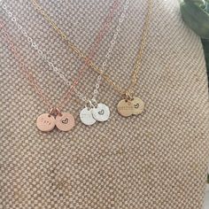 This beautiful dainty necklace features 2 of our Mini discs, 1 to contain a date, initial or (short) name/word of your choice, and the other is a disc with a love heart symbol. Mini Disc measures 9mm. 16", 18", 20" lengths with spring ring clasp. 14k Gold filled, 14k Rose gold filled or Sterling Silver. Available only in 1.5mm Tiny Block font. Handcrafted in Australia. Each piece is hand stamped & there may be slight variations such as with the letter alignment or spacing - this is not a defect Dainty Heart Charm Necklace For Best Friend, Dainty Heart Charm Necklace For Best Friend Gift, Dainty Hand Stamped Round Disc Necklaces, Dainty Hand Stamped Round Disc Necklace, Adjustable Heart Pendant Charm Necklace For Best Friend, Dainty Personalized Round Pendant Heart Necklace, Everyday Round Disc Charm Necklace For Mother's Day, Everyday Mother's Day Charm Necklace With Round Disc, Adjustable Heart Charm Necklace For Best Friend