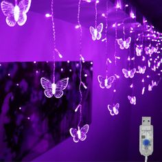 purple butterfly string lights hanging from the ceiling