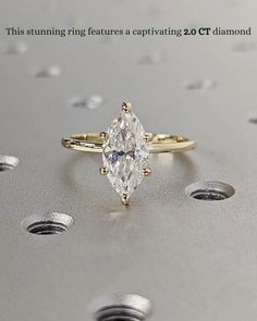 an engagement ring with a pear shaped diamond