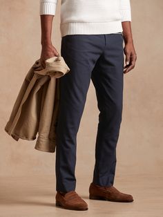 Crafted in a beautiful cotton-twill fabric from an Italian mill in a meticulous herringbone pattern, this pant is a go-to when chilly evenings call for formal style.  TAILORED SLIM FIT: A modern Slim fit, with a tapered leg and distinctive break at t Slim Fit Chinos For Business Casual In Fall, Slim Fit Cotton Chinos For Business Casual In Fall, Fall Slim Fit Chinos For Business Casual, Slim Fit Chinos With Welt Pockets For Fall, Fitted Cotton Chinos For Semi-formal Occasions, Classic Tapered Chinos For Fall, Elegant Chino Cotton Twill Workwear Bottoms, Classic Fitted Chinos For Fall, Classic Slim Fit Chinos For Fall