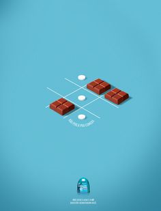 three pieces of chocolate sitting on top of each other in the middle of a blue background