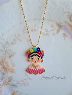 A beautiful handmade Frida patterned. It's displayed both sides. This is made with genuine Miyuki beads. It is high quality Japanese beads and brilliant colours and shape. It's came with a small gold colour chain.  The measurements; - Frida is 2.5cm. width from the top of the head and 4cm. height. - The necklace length is 55cm. (Without pendant)   This necklace will come with a small jewellery sheer drawstring pouch. Please feel free to contact me for the cost of delivery to everywhere else if outside Australia. Please note: product colour may slightly vary due to photographic lighting sources or your monitor settings. Miyuki Bead Necklace, Japanese Beads, Miyuki Bracelet, Daughter Quotes, Miyuki Beads, Delica Beads, Gold Colour, Drawstring Pouch, Small Jewelry