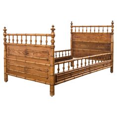 a bed with wooden posts and headboard made out of wood planks is shown