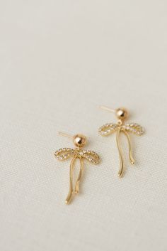 Rumor has is that 2024 is the year of BOWS! These super cute, dangly bow earrings will be the HIT of any party. Includes two gold or silver-plated dangly bows 6mm 14k gold-filled + sterling silver, hypoallergenic ball studs Choose from either solid or sparkly Everyday Wear Jewelry, Popular Now, Woman Business Owner, Strong Female, Bow Earrings, Perfume Spray, Jewelry Companies, Earrings Collection, Layered Look