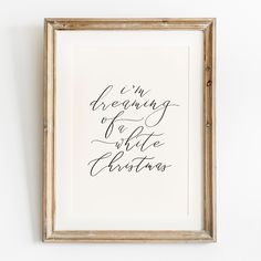 i'm dreaming of a little christmas calligraphy art print in gold frame on white wall