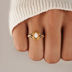 Our Vintage Royal Pearl Ring is a vintage-inspired dream come true. Crafted with stunning freshwater pearl, this beautiful piece is guaranteed to be a wardrobe essential for years to come. 18K gold-plated Stainless steel Natural freshwater pearl Hypoallergenic, lead & nickel free If you aren't in LOVE with your purchase, please let us know within 30 days of receiving your item, and you'll receive a stress-free refund. Royal Ring, Heirloom Ring, Pearl Wedding Ring, Pearl Rings Vintage, Vintage Gold Rings, Pearl Engagement Ring, Gold Pearl Ring, Natural Pearl, Pretty Rings