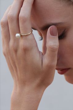 Beautiful and Timeless Ring with a white freshwater pearl, crafted in 14kt yellow gold. A big trend in 2020 - beloved by fashion icons on and off the runways. #klenota #klenotajewelry #ring #klenotaring #pearls #pearlrings #yellowgold #14k#14carat #minimalistic #valentinegift #giftideas #simple #pearls #anniversary #anniversaryrings #freshwaterpearl #pearljewelry
#minimalistic #statement #bestgift 14k Gold Jewelry With Pearl Drop For Anniversary, 14k Gold Pearl Drop Jewelry For Anniversary, 14k Gold Moonstone Open Ring, Gold Pearl Charm Open Ring, Pearl Drop Open Ring Jewelry, Classic Gold-plated Pearl Ring, Fine Jewelry 14k Gold Open Moonstone Ring, Gold Timeless Pearl Promise Ring, 14k Gold Open Moonstone Ring In Fine Jewelry Style