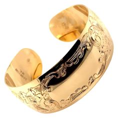 Vintage 1990’s 14k yellow gold engraved cuff bangle bracelet. There is space in the center to engrave a monogram. The cuff measures .88 inches wide and weighs 33.22g. Luxury Vintage Engraved Bangle, Yellow Gold Cuff Bracelet, Engraved Cuff, Cuff Bangle Bracelet, Gold Bracelet Cuff, Gold Engraving, Gold Hand, Gold Cuffs, Wide Cuff