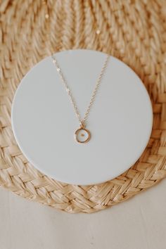 "Dainty, minimalistic, gold filled necklace that represents so much more. Encased in a small gold filled bezel is a REAL mustard seed. Serving as a meaningful reminder to have faith in Christ. Each necklace is packaged in a white box and comes with a keepsake card. Minimal in design, but packed full of meaning. Perfect for every day wear. Featuring a 16\" chain. These necklaces are 14k gold filled, which means they are NOT plated. They will not change colors on you or turn your skin green like p Minimalist Birth Flower Charm Necklace With Initial Pendant, Minimalist Initial Pendant Charm Necklace With Birth Flower, Minimalist Birth Flower Initial Pendant Charm Necklace, Minimalist Birth Flower Initial Pendant Necklace, Minimalist Jewelry With Birth Flower Initial Pendant, Minimalist Birth Flower Necklace For Everyday, Minimalist 14k Gold Filled Birth Flower Jewelry, Minimalist Birth Flower Initial Pendant Jewelry, Minimalist Everyday Birth Flower Necklace