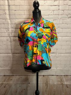 Colourful fun 1990's lightweight button up top. Womens medium  Shoulder to shoulder 15" Armpit to armpit 17.5" Length 21" Retro Multicolor Print Summer Blouse, Retro Multicolor Print Blouse For Summer, Multicolor Retro Print Button-up Top, Retro Summer Blouse With Colorful Pattern, Colorful Retro Shirt With Graphic Print, Retro Colorful Pattern Blouse For Summer, Retro Colorful Summer Blouse, Retro Blouse With Colorful Pattern For Summer, Fun Collared Tops For Spring