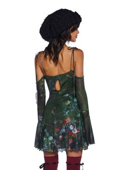 This mini dress has a stretchy knit construction with a mesh overlay, an all-over floral art print, lace detailing, a front self-tie closure, off-the-shoulder sleeves with bell cuffs, self-tie shoulder straps, a lettuce trimmed hem, and a back hook closure. Spring Off-shoulder Mini Dress With Sheer Sleeves, Spring Sheer Sleeved Off-shoulder Mini Dress, Bohemian Fitted Dress With Sheer Sleeves, Fitted Bohemian Dress With Sheer Sleeves, Summer Party Mini Dress With Bell Sleeves, Spring Dress With Sheer Bell Sleeves, Party Dresses With Floral Print And Bell Sleeves, Spring Fitted Mini Dress With Bell Sleeves, Bohemian Fitted Mini Dress With Bell Sleeves