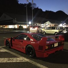 a red sports car parked in a parking lot