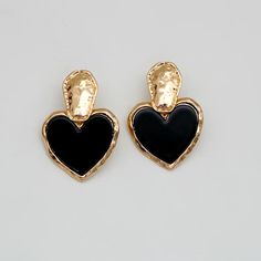 Discover Timeless Elegance Introducing our latest collection piece, the Black Heart Drop Earrings, a perfect blend of vintage charm and contemporary fashion. These earrings feature a classic heart shape, embodying love and elegance in every detail. Crafted from durable zinc alloy, they boast a glossy black finish that adds a touch of sophistication to any outfit. Ideal for women who adore fashion-forward accessories, these earrings are sure to make a statement at any event. Product Features Our Black Heart Drop Earrings are more than just a fashion statement. They are designed with the modern woman in mind, offering both style and comfort. The zinc alloy material ensures durability and long-lasting wear, while the heart-shaped design exudes romance and elegance. With their easy-to-wear dro Cheap Black Heart-shaped Earrings, Black Metal Earrings With Heart Charm, Elegant Black Earrings With Heart Charm, Black Heart Charm Earrings As Gift, Black Earrings With Heart Charm For Gift, Black Heart-shaped Earrings For Gift, Elegant Black Metal Heart Earrings, Black Heart Earrings As A Gift, Black Heart Earrings For Pierced Ears As Gift