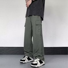 Our Casual Literary Straight Cargo Pants are an essential piece for any stylish look. Boasting a sophisticated solid color and deep pocket detail, these premium pants are the perfect balance of casual and literary. Ideal for any occasion, you'll feel both comfortable and confident in these urban-chic trousers. Features: -100% Cotton -Mid-rise waist -Solid Color -Straight Leg -Regular Fit -Casual style Streetwear Trousers With Welt Pockets, Wide Leg Work Pants With Welt Pockets For Streetwear, Wide-leg Cotton Pants With Multiple Pockets, Cotton Wide-leg Pants With Multiple Pockets, Baggy Green Work Pants With Pockets, Cotton Wide Leg Cargo Pants, Solid Wide Leg Cotton Cargo Pants, Green Baggy Work Pants With Pockets, Straight Leg Chinos With Cargo Pockets For Streetwear