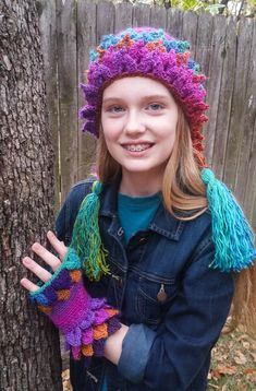 Crochet Leafy Tassel Hat, This soft and stylish hat is made with a crochet technique called dragon scale or crocodile stitch. I use a super soft high quality glossy wool blend yarn, it comes in a variety of vibrant multicolors. The main body of the hat has a beautiful ribbed pattern and the edging is a leafy crocodile stitch that comes into points. The sides of the hat come down far enough to cover the ears and end with fun whimsical tassels. Made to Order: This is a made to order item, I will s Dragon Scale Hat Crochet Pattern Free, Green Whimsical Crochet Yarn Hat, Whimsical Green Crochet Hat, Fleece Dragon Hat Pattern, Crochet Dragon Boys Hat, Fairy Hat, Stitch Ears, Flap Hat, Trapper Hat