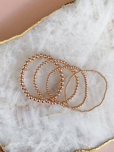 14k rose gold filled beaded stretch bracelet. Please measure your wrist and select your size in the dropdown as this bracelet is not one size fits all. SIZING TIP: To find out your bracelet size, wrap a piece of string around your wrist to measure (place it just above the wrist bone.) Then measure the length of the string. Then I'd recommend adding 0.8 inches (2cm) to that measurement to get your correct bracelet size. Rose Gold Stackable Stretch Bracelet With Round Beads, Rose Gold Stackable Bracelet With Round Beads, Dainty Rose Gold Beaded Bracelets, Stackable Round Beads Bracelets In Rose Gold, Rose Gold Beaded Bracelets With 8mm Beads, Delicate Stackable Rose Gold Bracelets, Delicate Rose Gold Stackable Bracelets, Stackable Rose Gold Bracelets In 14k Gold Filled, Rose Gold Beaded Bracelets With 14k Gold Filled