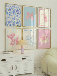 a living room filled with furniture and pictures on the wall above it's side table