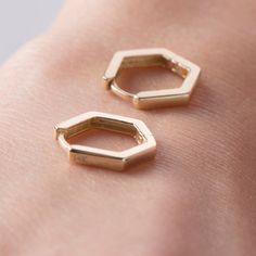 Elevate your style with our dainty hexagon huggie hoops, crafted from 14k solid gold. These unique earrings, with their uncommon yet refined design, have quickly become one of our best sellers. Perfect for adding a touch of subtle sophistication to any look, these huggie hoops are a must-have for those who appreciate fine craftsmanship and standout style. This piece is crafted with real 14k solid gold(not plated, not vermeil, not gold filled) You don't need to worry about water, perfume or condi Real Gold Earrings, Zodiac Jewelry, Vermeil Jewelry, Evil Eye Bracelet, Fine Earrings, Nice Things, Jewelry Business, Gold Hoops, Star Pendant