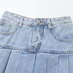 Elevate your style with our iconic 90s-inspired pleated miniature jean skirt from the 2023 Summer Collection. Perfect for sunny summer days and breezy summer nights. this mid-rise skirt features a light wash. a zipper & button closure. and pleats that will take your look to the next level.Why You'll Fall In LoveThis 90s-inspired mini skirt is the perfect blend of feminine charm and timeless style. With its mid-rise form and light wash. it's sure to add instant style to your wardrobe. The pleats. Retro Mini Pleated Skirt For Spring, Spring Retro Mini Pleated Skirt, Y2k Style Pleated Denim Skirt, Trendy Pleated Short Denim Skirt, Y2k Style Pleated Mini Skirt For Spring, Y2k Style Pleated Mini Skirt For Summer, Spring Y2k Pleated Mini Skirt, Casual High Waist Pleated Skirt For Spring, Y2k Mini Jean Shorts For Spring