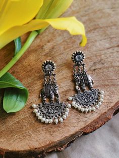 Stunning heavy look ethnic earrings  jhumka jhumki stud Afghani earrings in silver tone  With intricate carved work and sparkling ghunghroos which gives a traditional touch to the earrings  Perfect with ethnic and traditional wear  Can be a perfect gifting option for friends and dear ones  Silver metallic ghunghroo tinkle to create a striking look  With intricate carved word and sparkling ghunghroo which gives a traditional touch to the earring. Silver metallic base tinkle to create a striking l Cheap Metal Jhumkas For Festivals, Cheap Handmade Women's Jhumkas, Cheap Jhumkas For Navratri, Affordable Traditional Silver Earrings, Silver Bohemian Style Drop Jhumkas, Bohemian Silver Chandbalis With Matching Earrings, Silver Bohemian Metal Chandbalis, Bohemian Silver Metal Chandbalis, Silver Oxidised Earrings