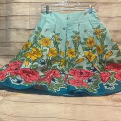 *Skirt Fabric:95% Cotton 5% Spandex *Skirt Color: Blue/Teal Floral Design *Skirt Closure:Zipper(Back) *Skirt Features: 1) Waistline Is Not Elastic 2) Pleated Design 3) Hidden Zipper In The Back 4) Vibrant Pattern 5) Flared A-Line Silhouette 6) Skirt Is Little Elastic 7) Unlined *Package Contents:1*Skirt(No Accessories Included) Blue Retro Cotton Skort, Retro Pleated Mini Skirt For Spring, Retro Blue Cotton Skort, Light Blue Stretch Skirt For Summer, Retro Blue Fitted Skort, Blue Gathered Mini Skirt, Blue Mini Skirt With Gathered Detail, Retro Spring Flared Mini Skirt, Retro Flared Mini Skirt For Spring