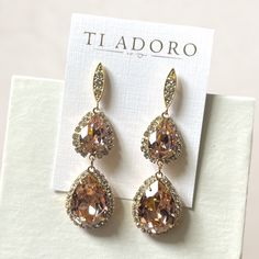 Ti Adoro Brand Addison Earrings Graceful, Classic, And Most Important Of All, Beautiful. The Addison Earrings From Ti Adoro Are Sure To Complement Any Gown You Wear And Make You The Talk Of The Ball. Made With Rose-Colored Stones With Crystals Surrounding Them, The Addison Earrings Are Nothing Short Of Elegant. Dimensions: 2 1/4” Color: Gold Stone: Rose Pink Stone Is Much Pinker In Person And Softer But With Light Reflection Appears More Gold Perfect For Wedding, Black Tie, Elegant Events New Wi Formal Pink Chandelier Earrings, Elegant Pink Chandelier Earrings For Formal Occasions, Elegant Pink Chandelier Earrings For Formal Events, Pink Teardrop Earrings For Wedding, Pink Gold Dangle Jewelry For Wedding, Pink Drop Bridal Earrings For Formal Occasions, Pink Gold Dangle Earrings For Wedding, Elegant Pink Dangle Bridal Earrings, Pink Dangle Teardrop Earrings For Wedding