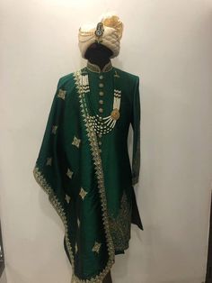 Hand Embroidered Groomswear Sherwani Set in Dark Green and Gold Green Raw Silk Sherwani With Dabka Detail, Green Raw Silk Dabka Sherwani, Green Dabka Raw Silk Sherwani, Eid Sherwani With Dabka Work For Traditional Ceremonies, Ceremonial Anarkali Sherwani In Raw Silk, Anarkali Style Ceremonial Sherwani In Raw Silk, Anarkali Style Raw Silk Sherwani With Zari Work, Ceremonial Embroidered Sherwani With Traditional Drape, Ceremonial Semi-stitched Sherwani With Intricate Embroidery