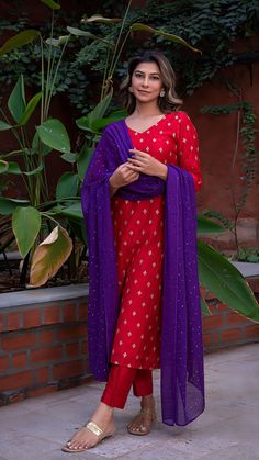 Bring on the festive spirit with our kurta set in hand embroidered chanderi silk. Fully lined kurta and pants. Made in chanderi silk. Dupatta in mul cotton with gold tikki details. Color of Kurta + Pants : Red. Color of Dupatta : Purple. Model height is 5.6” and is wearing a size S. Wash Care : Dry Clean Only. Designer Red Cotton Silk Churidar, Red Semi-stitched Slub Silk Churidar, Red Cotton Silk Sharara With Cutdana, Red Cotton Silk Sharara With Cutdana Details, Red Unstitched Slub Silk Churidar, Unstitched Red Slub Silk Churidar, Festive Slub Silk Sharara With Dabka Work, Chanderi Sharara With Resham Embroidery, Red Cotton Silk Bollywood Kurta