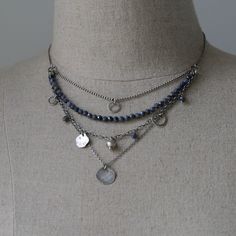 "The Raw Silver and Sapphire Layered Necklace for Women is a stunning piece of handcrafted jewelry. Made with sterling silver and featuring blue sapphire gemstones, this necklace showcases the natural beauty of these materials. The beaded necklace is oxidized and polished, adding depth and charm to the overall design. Its boho style gives it a trendy and fashionable appeal. Layered necklace for women is perfect jewelry gift for sister or wife. Dress up your necklace on special occasion, or send Cheap Silver Layered Beaded Necklace, Cheap Silver Layered Jewelry, Cheap Bohemian Silver Layered Necklace, Cheap Silver Beaded Chain Layered Necklace, Affordable Silver Layered Jewelry, Boho Choker Necklace Silver, Trendy Jewelry Silver, Boho Jewelry Silver, Silver Sterling Silver Beaded Necklace