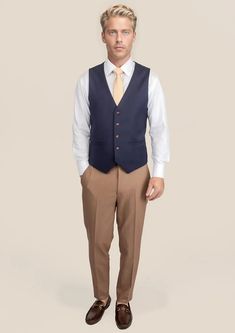 Elevate your style with our custom-made Stratos Blue Sharkskin Vest. With its exquisite craftsmanship and luxurious Super 110s wool mohair blend, this vest is the perfect finishing touch for any suave look. Experience the ultimate sophistication with this must-have piece in your wardrobe. Classic V-neck Suits For Semi-formal Occasions, Classic V-neck Semi-formal Suits, Classic Single-breasted V-neck Vest, Elegant Blue V-neck Vest, Elegant V-neck Vest For Formal Occasions, Formal Blue V-neck Outerwear, Fitted V-neck Suits For Semi-formal Occasions, Fitted Single Breasted V-neck Vest, Semi-formal Sleeveless Vest For Fall