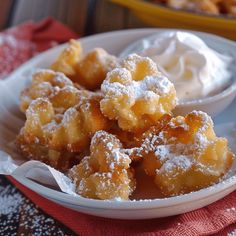 a white bowl filled with powdered sugar on top of a table