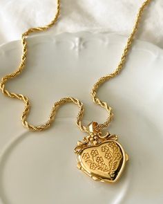 The Mon Amour Locket, my love locket is a beautiful locket you can keep your treasures close to the heart. Gold plated silver functioning heart locket measuring 25mm x20mm x6.7mm. You can adhere photos or leave a secret message . Gold plated brass rope chain 2.5mm thick and 16-18 inches in length . Heirloom Pendant Locket Necklace With Charms, Heart-shaped Locket Jewelry For Memorials, Heart-shaped Locket For Memorial, Engraved Spiritual Locket Necklace For Valentine's Day, Victorian Heart Charm Locket Pendant Necklace, Victorian Heart Charm Locket Necklace, Heart Locket Necklace With Vintage Charm For Memorial, Heart Charm Medallion Locket Necklace Keepsake, Victorian Pendant Locket Necklace For Valentine's Day