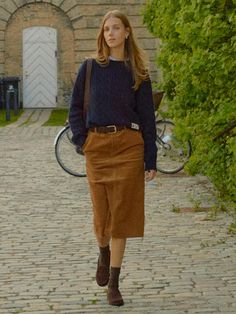 The Randers Pencil Corduroy Skirt is a versatile piece that combines classic corduroy material with a modern design. It features the semi low-rise H-line skirt made of sturdy corduroy material.- Medium length for slim body coverage- Side pockets and back pockets- Completed with contrasting detail inside the waistband for a polished look* The actual color of the product is the most similar to the product cut. Midi Suede Skirt, Tan Courderoy Skirt Outfits, Corduroy Long Skirt Outfit, Curdoroy Outfit Womens, Tan Corduroy Skirt Outfit, Tan Skirt Outfit Fall, Blue Corduroy Skirt Outfit, Everyday Skirt Outfits, Courderoy Skirt Outfits Women