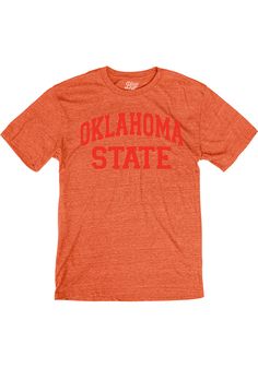 Support your Oklahoma State Cowboys in this Orange Short Sleeve Fashion Tee! This Arch Team Name Fashion T Shirt features a screen print of arched team name across chest. Be ready to shout "Go Pokes" when you wear this OSU Short Sleeve Fashion T Shirt in the stadium or on the street. Short sleeve, Cover seam stitched rib knit collar, Double needle stitched sleeves and bottom hem, Unisex, Screen print team graphic, 50% Polyester/ 37% Cotton/ 13% Rayon Fall College T-shirt With Embroidered Graphics, Sporty T-shirt With Embroidered Graphics For Game Day, Varsity T-shirt With Embroidered Graphics For Fall, Casual Cotton T-shirt For Game Day, Collegiate Embroidered Crew Neck T-shirts, Collegiate Tops With Embroidered Graphics For College, Cotton Varsity T-shirt With Lettering, Casual T-shirt With Lettering For Game Day, Collegiate Cotton T-shirt With Embroidered Graphics