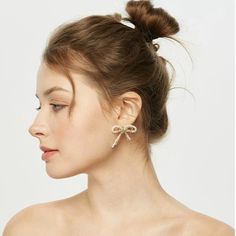 Elevate your style with the whimsical charm of COCOKIM's Starlight Series Bow Stud Earrings. These delightful earrings feature intricately crafted bow designs, exuding elegance and femininity. Perfect for adding a touch of playful sophistication to any outfit, these studs are a versatile accessory for any occasion. Metal: 14K Gold Filled Gemstone: Freshwater Pearl Width Diameter: 40mm High Diameter: 35mm Bow Designs, Edison Pearls, Ear Clips, Tiger Eye Stone, Bow Design, Ring Earrings, Freshwater Pearls, Gold Filled, Stud Earrings