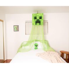 a bed with a green mosquito net over it