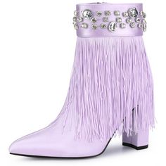 a pair of purple boots with fringes and crystal stones on the heel, in front of