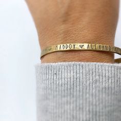 "Personalized Cuff Bracelet - Gift for Mom - Personalized Gift - Custom Cuff with Names - personalized jewelry gift for her - Grandma Gift 1/8\" x 6\" skinny cuff is given a hammered finish and is personalized with the names if your choice each separated by a little heart. Choose from sterling silver, gold filled(shown) or rose gold filled." Personalized Name Bracelet For Anniversary, Meaningful Personalized Name Bracelet For Anniversary, Personalized Name Bracelet For Gifts, Personalized Name Bracelet For Gift, Personalized Meaningful Name Bracelet Gift, Personalized Name Bracelet For Mother's Day, Customizable Name Bracelet For Meaningful Gift, Customizable Meaningful Name Bracelet For Gift, Customizable Inspirational Name Bracelet As A Gift