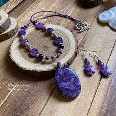 Purple crazy lace agate jewelry set natural stone amethyst necklace earrings set beaded boho tribal unique silver bohemian jewelry for women Necklace: 20 inches Earrings: 1.5 inches This gorgeous purple jewelry set has a 40mm oval purple crazy lace agate pendant, 12mm purple crazy lace agate square beads, 4mm-6mm purple crazy lace agate beads, 8mm-10mm Amethyst gemstone beads, 15/0 purple seed beads, Bali beads, silver plated findings, toggle and ear wires. Can't find your stone or color? I spec Purple Jewelry Set, Jewelry Set Design, Square Beads, Rainbow Jewelry, Purple Jewelry, Women Necklace, Beaded Anklets, Agate Jewelry, How To Make Necklaces