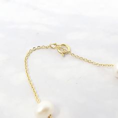 Our Freshwater Pearl Double Chain Wedding Bracelet, crafted with 18ct gold-plated copper and adorned with freshwater pearls, is the perfect elegant gift for brides, bridesmaids, or any special occasion.  Elevate your bridal ensemble with our Freshwater Pearl Double Chain Wedding Bracelet, an exquisite accessory perfect for bridesmaids or brides on their special day.   This jewellery arrives beautifully packaged and ready to gift. It would make a really thoughtful and meaningful birthday gift, Ch Elegant Gold Single Strand Bridal Necklace, Elegant Single Strand Gold Bridal Necklace, Wedding Baroque Pearl Chain Bracelet, Elegant Gold Bracelet With Baroque Pearl, Delicate Baroque Pearl Bracelet With Pearl Chain, Delicate Baroque Pearl Chain Bracelet, Delicate Baroque Pearl Bracelet, Refined Yellow Gold Pearl Necklace For Wedding, Refined Gold Wedding Jewelry